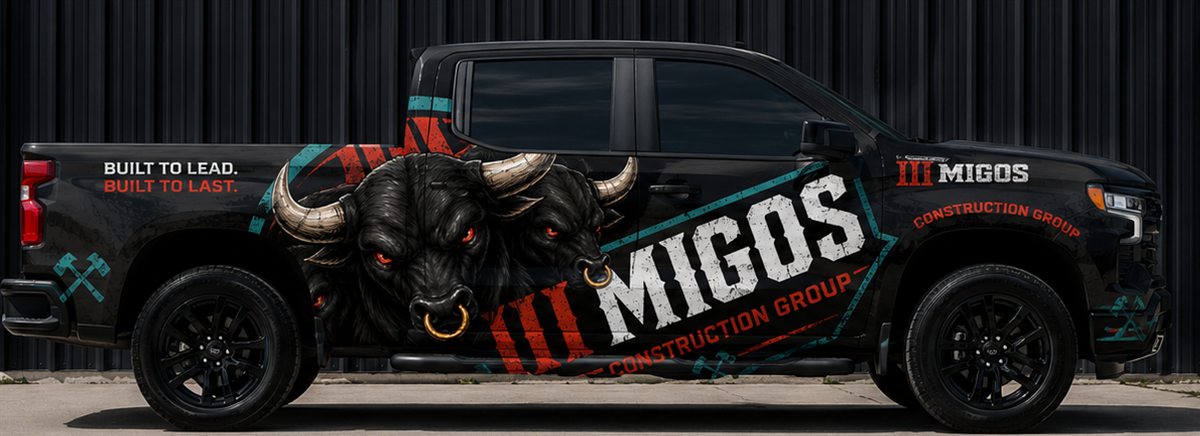 Black pickup truck wrapped in III Migos Construction Group graphics with the bull logo and the words Built to lead, Built to last